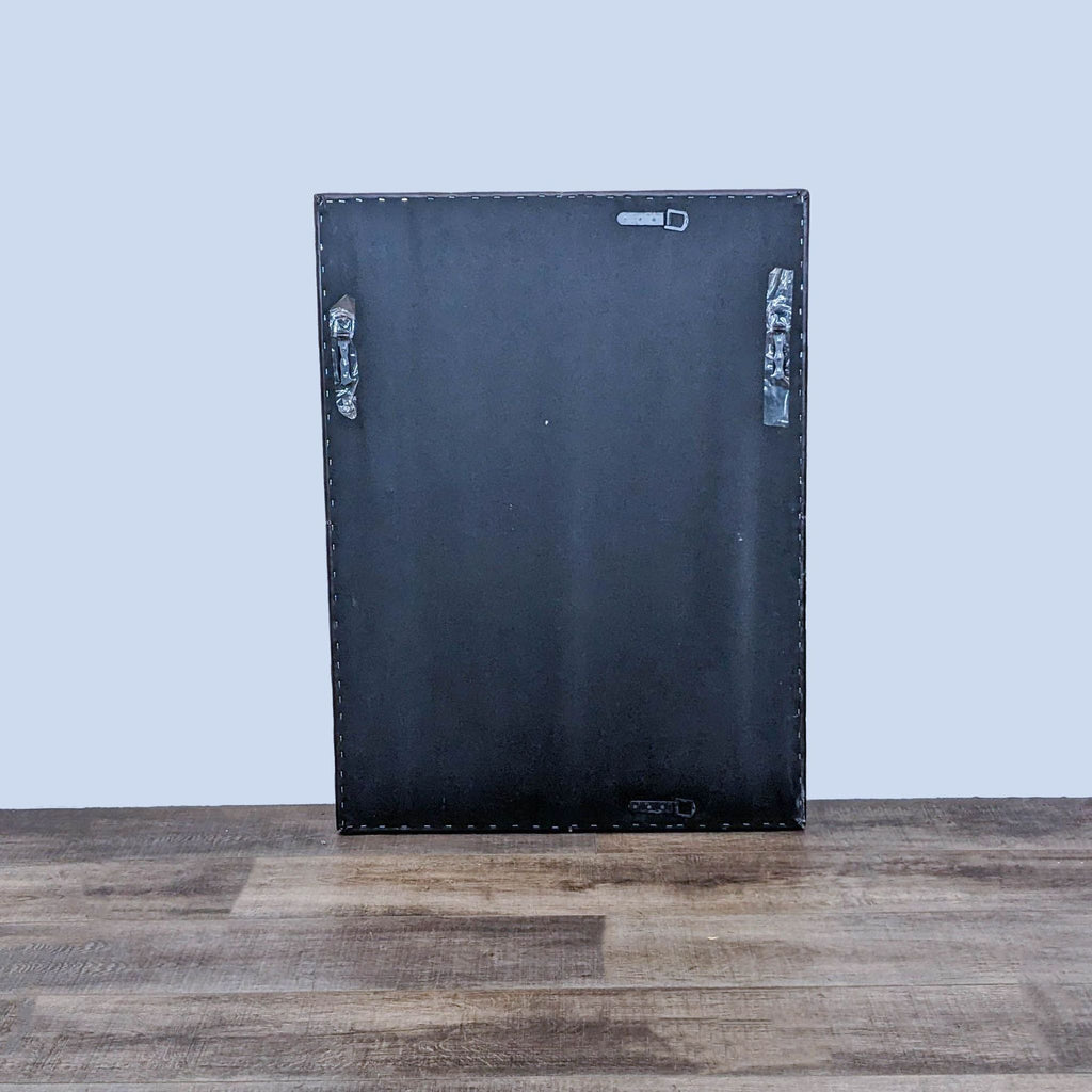 Back view of a rectangle mirror with mounting hardware, showcasing leather frame detailing.