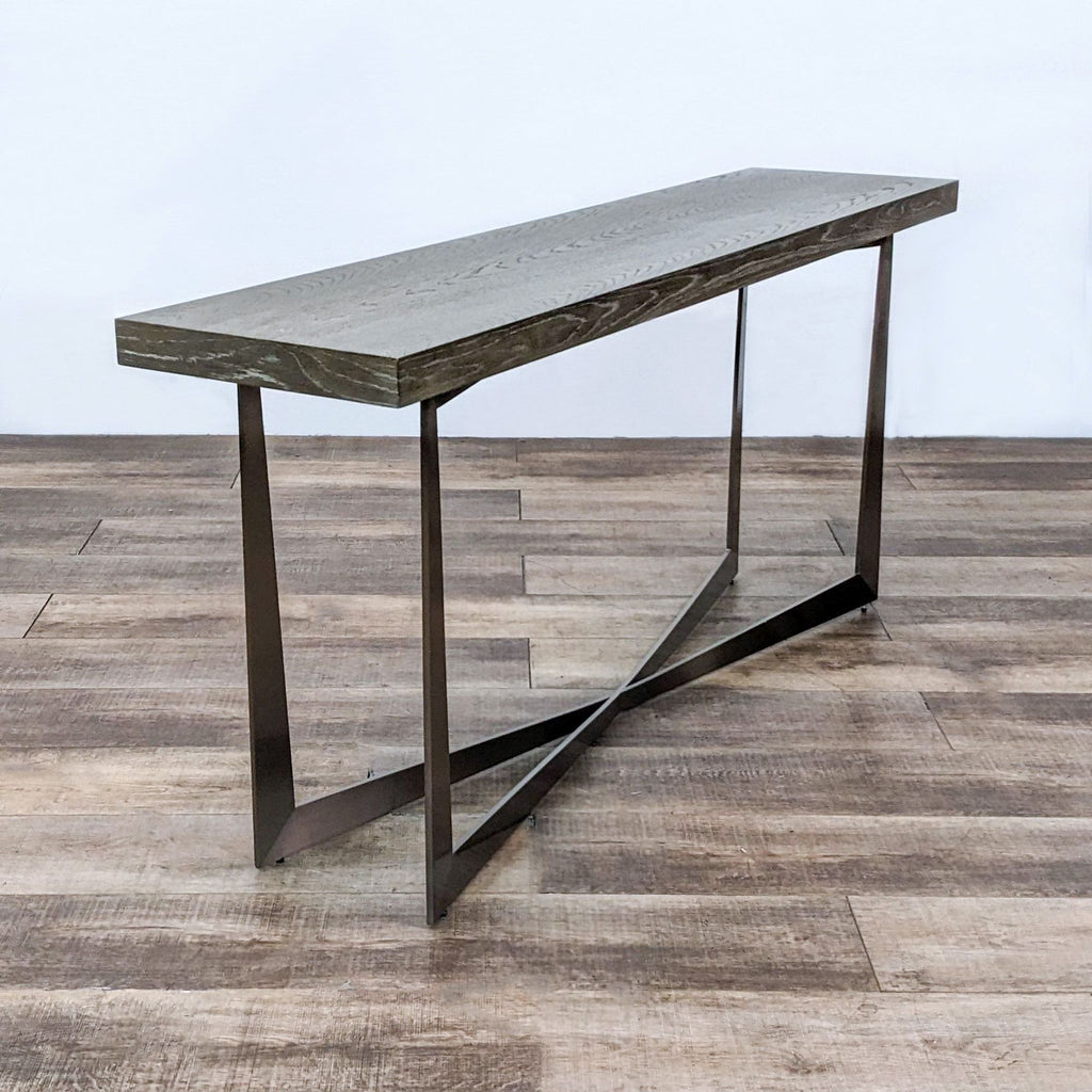 Contemporary Reperch side table showcasing rich wooden grain finish atop a sleek metal frame on a patterned floor.