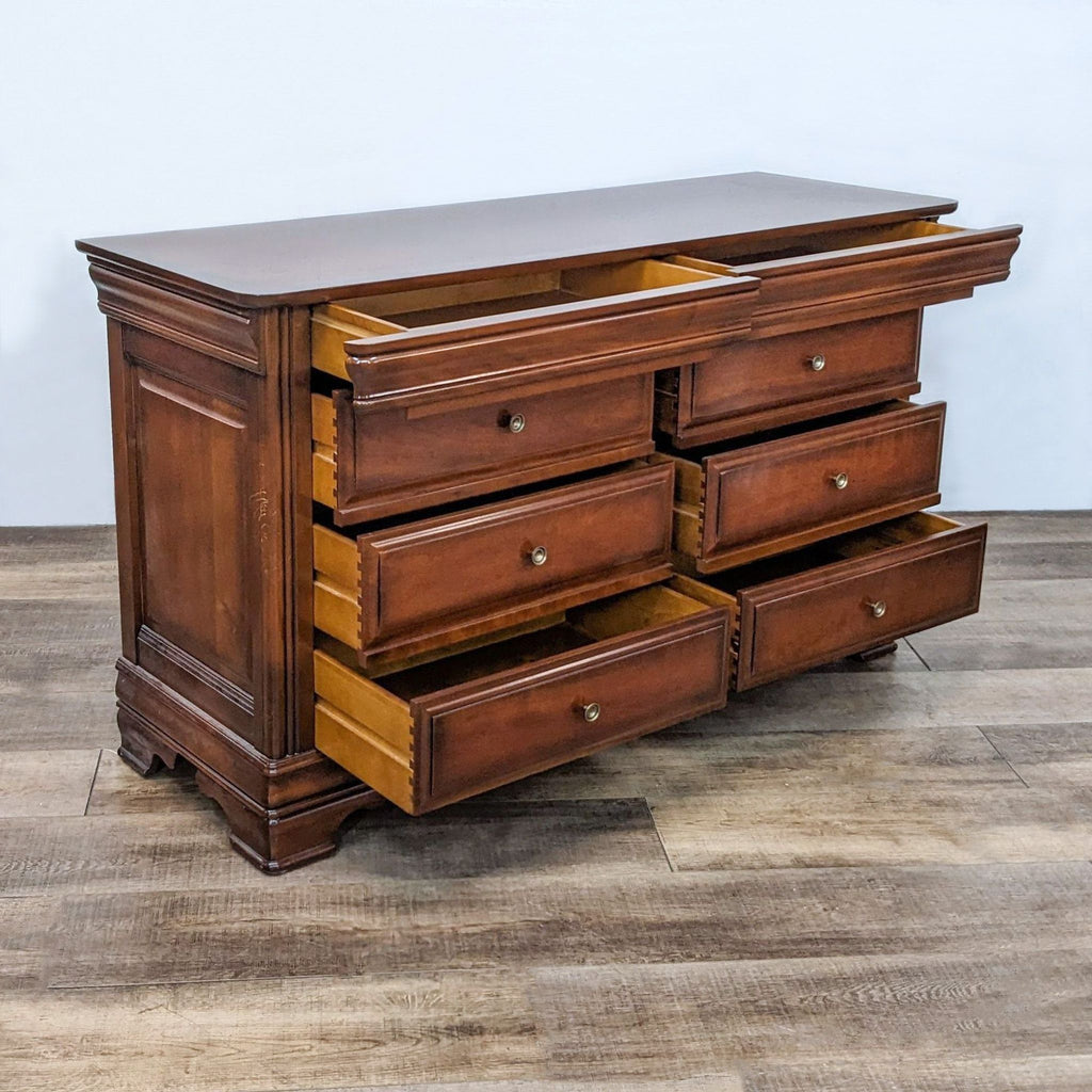 8-drawer wooden dresser with dovetail joinery, antique finish by Reperch.