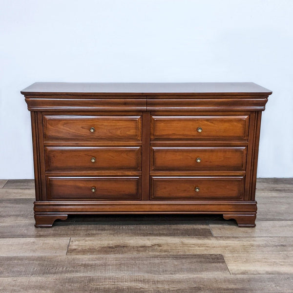 Traditional Reperch dresser with 8 drawers and antique brass knobs.