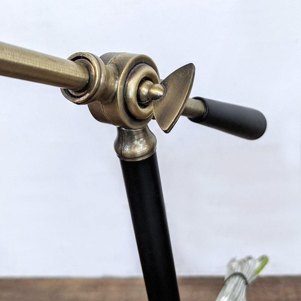 a large and heavy brass and brass hand - held table lamp.