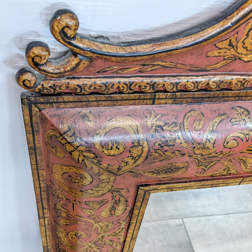 Close-up of ornately carved and painted wood frame of a vintage mirror with intricate details. Brand: Reperch.