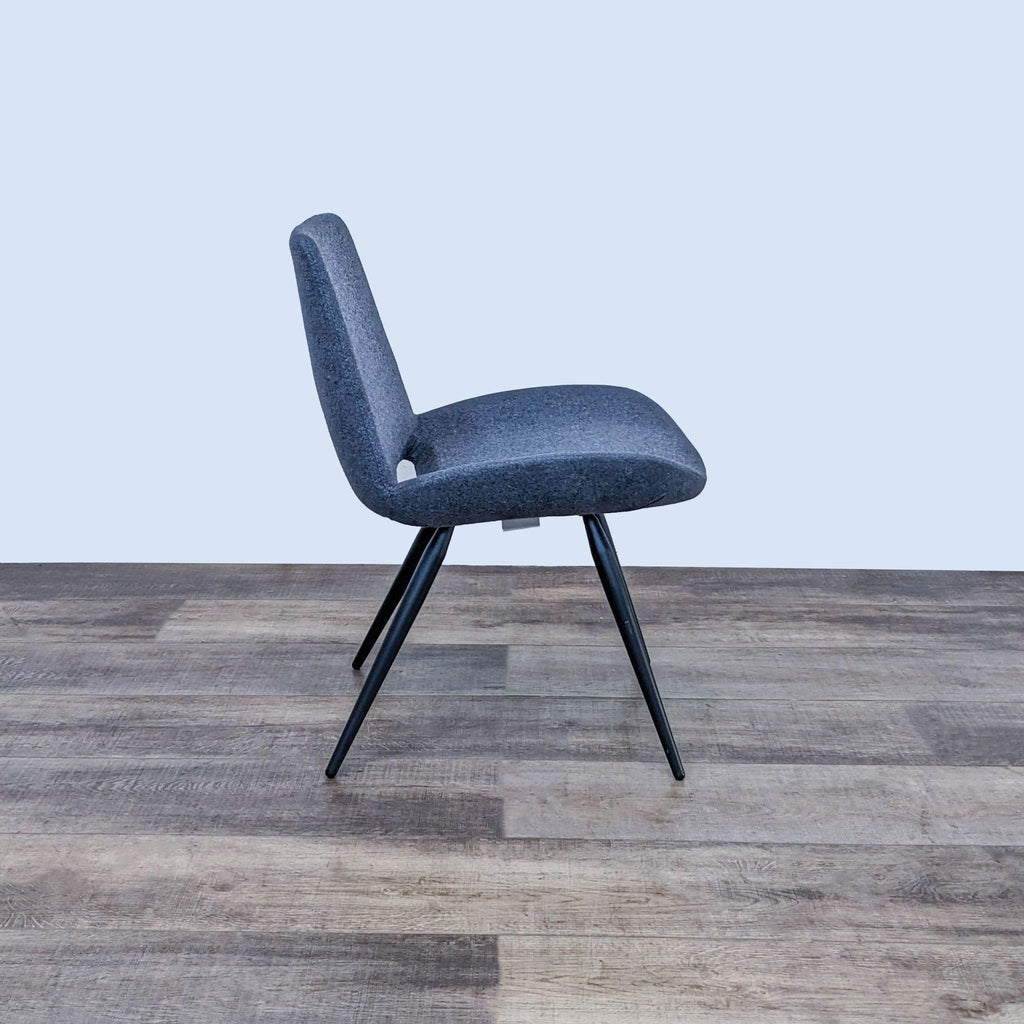 Side view of an ergonomic dining chair with a cushioned seat.