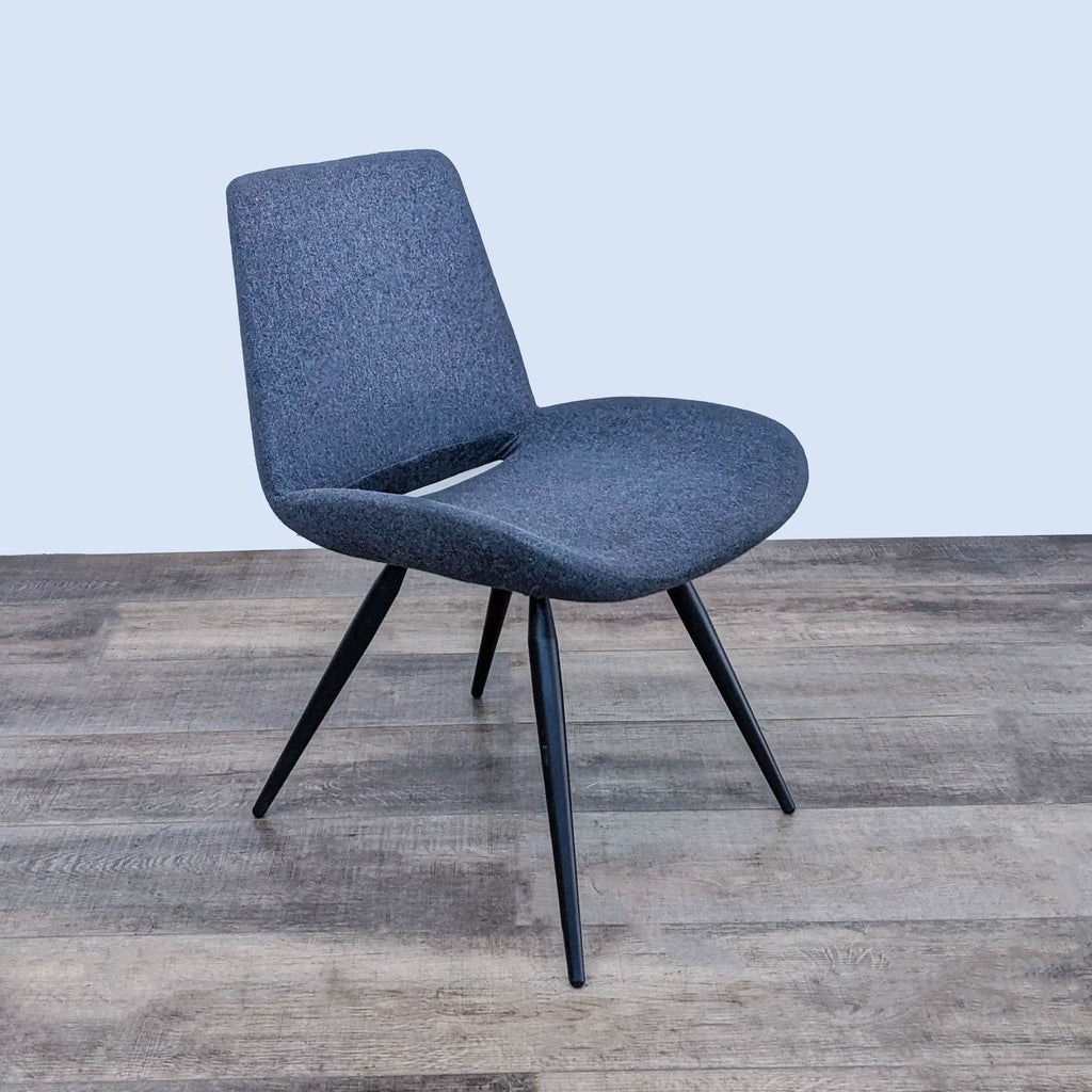 Angled view of a upholstered dining chair emphasizing its sleek design.