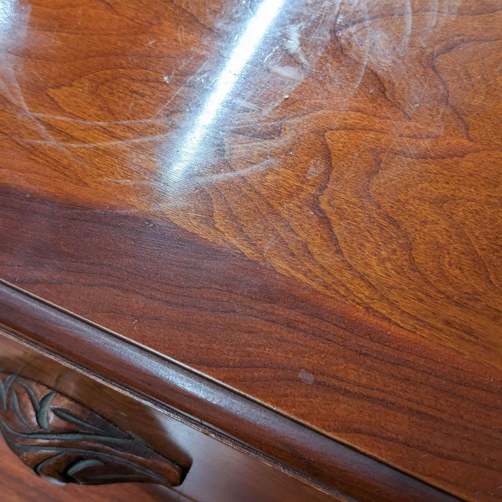 Close-up of Reperch Victorian-style sideboard showing wood grain and carved drawer pull.