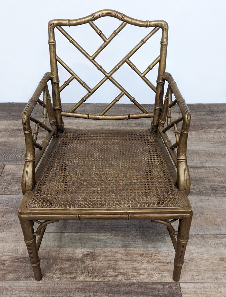 Reperch bamboo-style dining chair with a woven rattan seat and an exotic faux bamboo frame on a wooden floor.