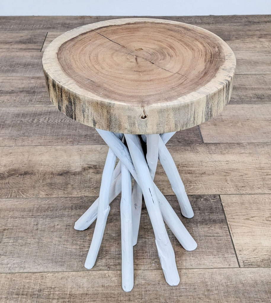 Top view of Reperch console table with branch base and circular wood surface.