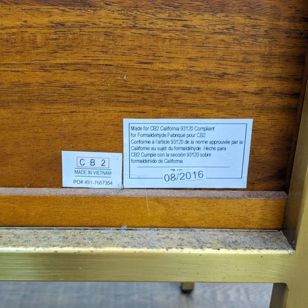 Close-up of CB2 label on Memento Cabinet made in Vietnam, dated 08/2016.
