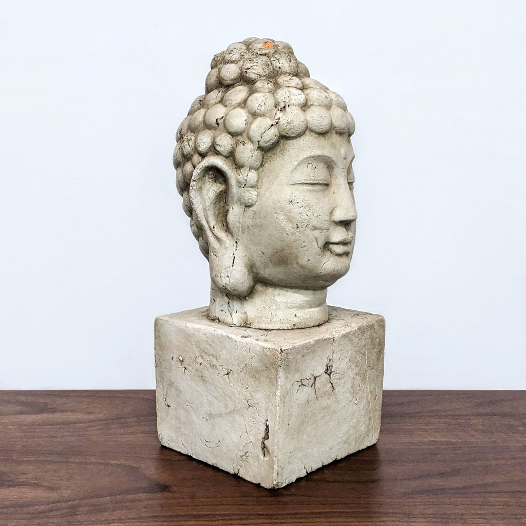 Terra cotta Buddha sculpture with aged finish, side angle, on a wood base.