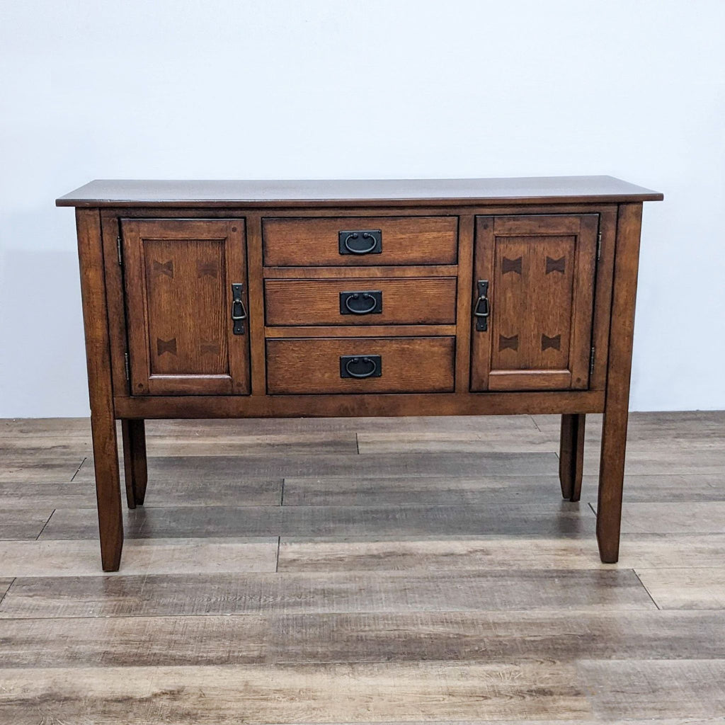 Reperch sideboard with wood finish, featuring bow tie inlays and metal hardware on cabinet doors.