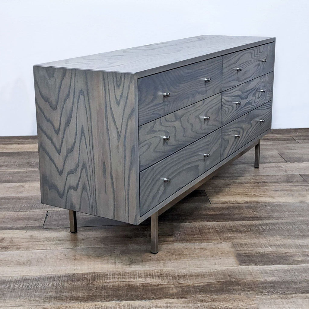 Side view of a stylish six-drawer dresser with clean lines.
