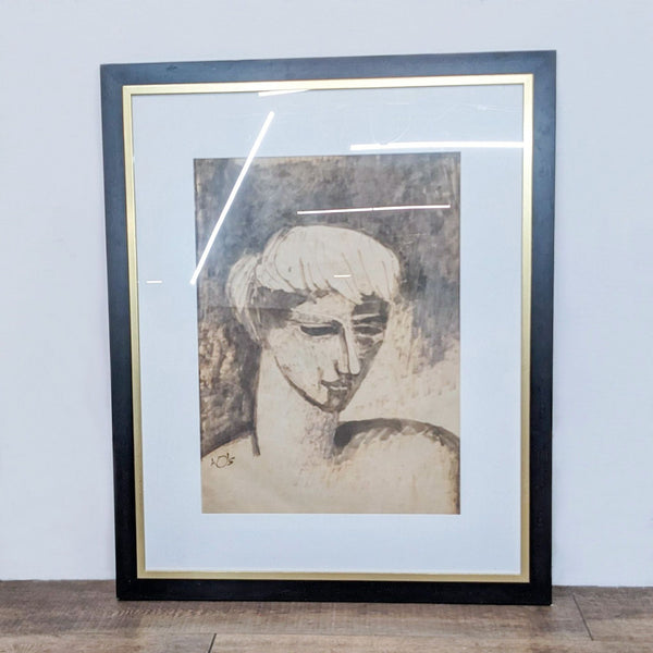 Framed monochromatic portrait of a boy, artistically signed.