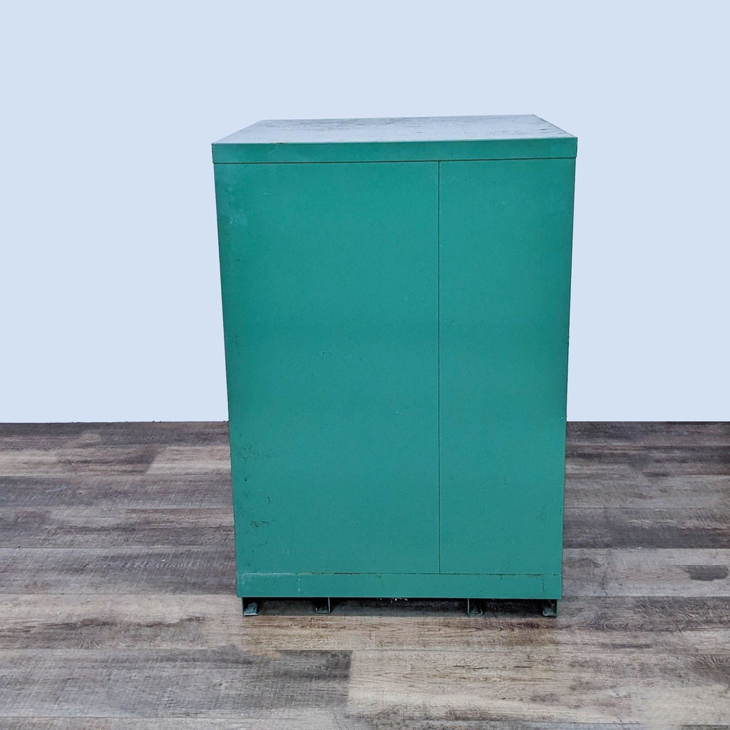 Back view of the green Lista cabinet, highlighting its robust metal structure.