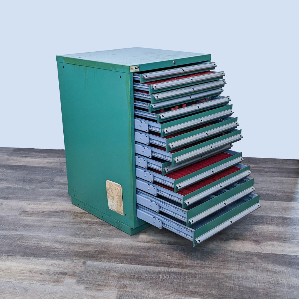 Open-view of green tool cabinet, showcasing its spacious, organized drawers.