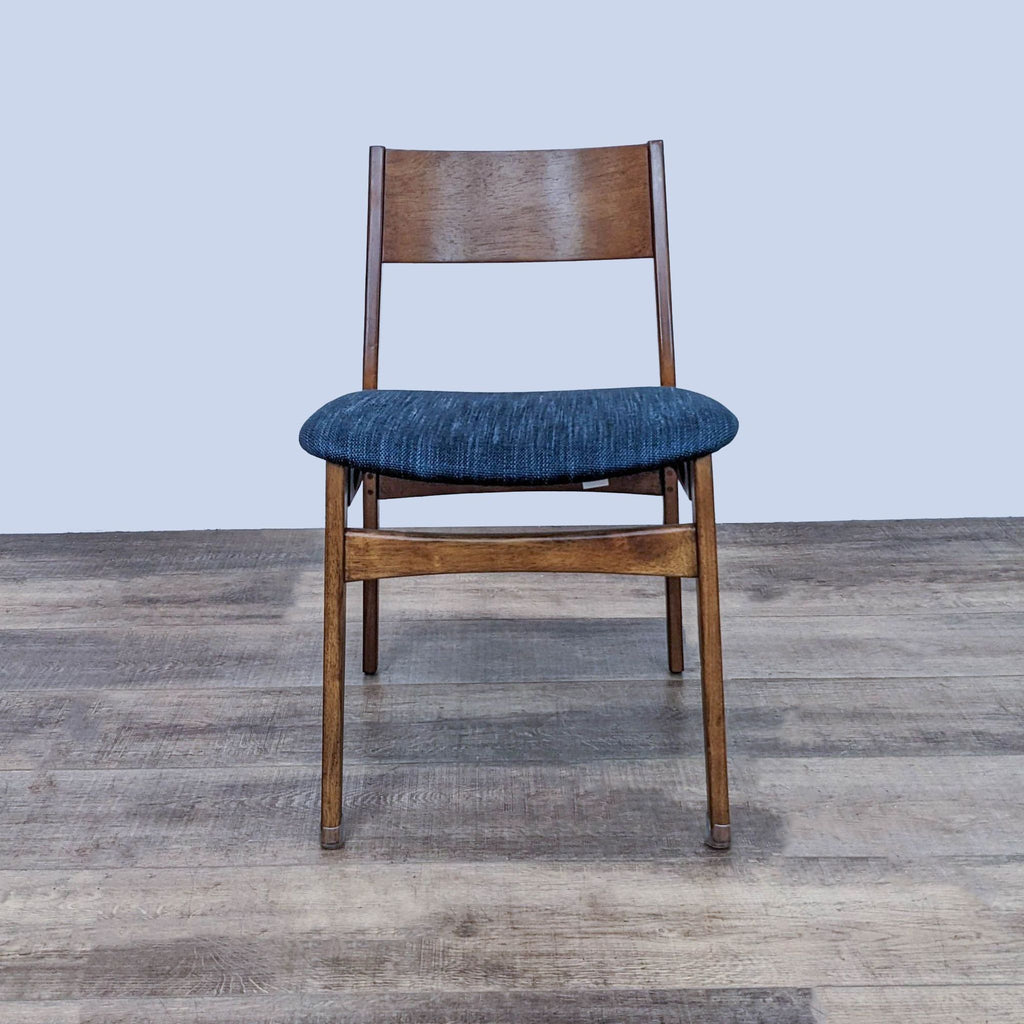 Front view of the Baltimore dining chair in wood and fabric upholstery.