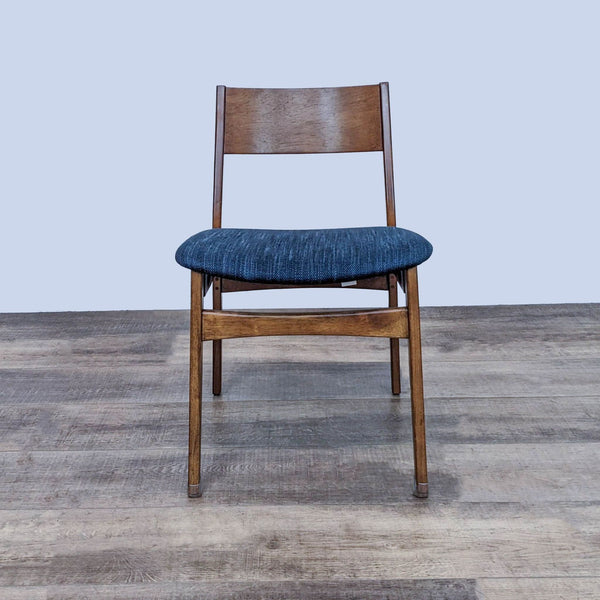 Front view of the Baltimore dining chair in wood and fabric upholstery.