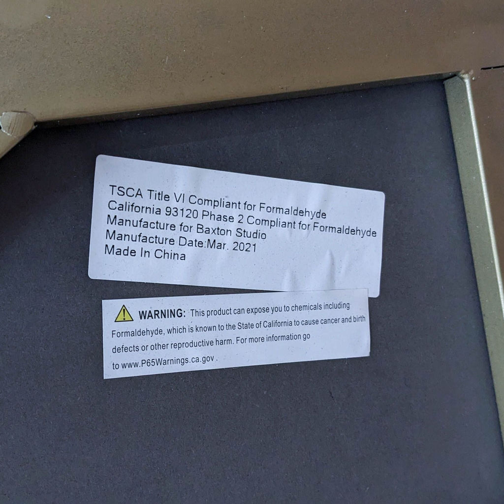 Formaldehyde compliance label on the underside of a Baxton Studio table, manufactured March 2021.