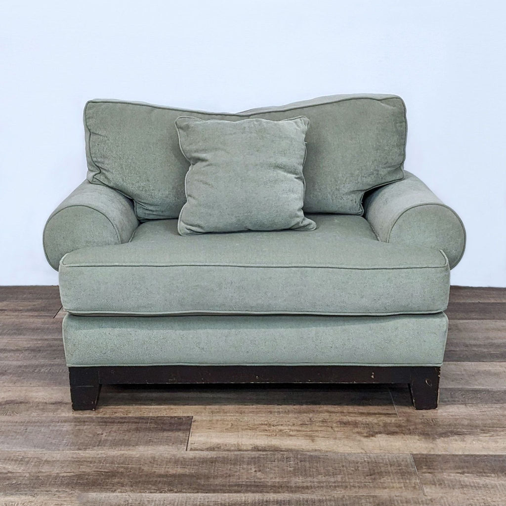 Cozy reading chair with soft cushions and ample space.