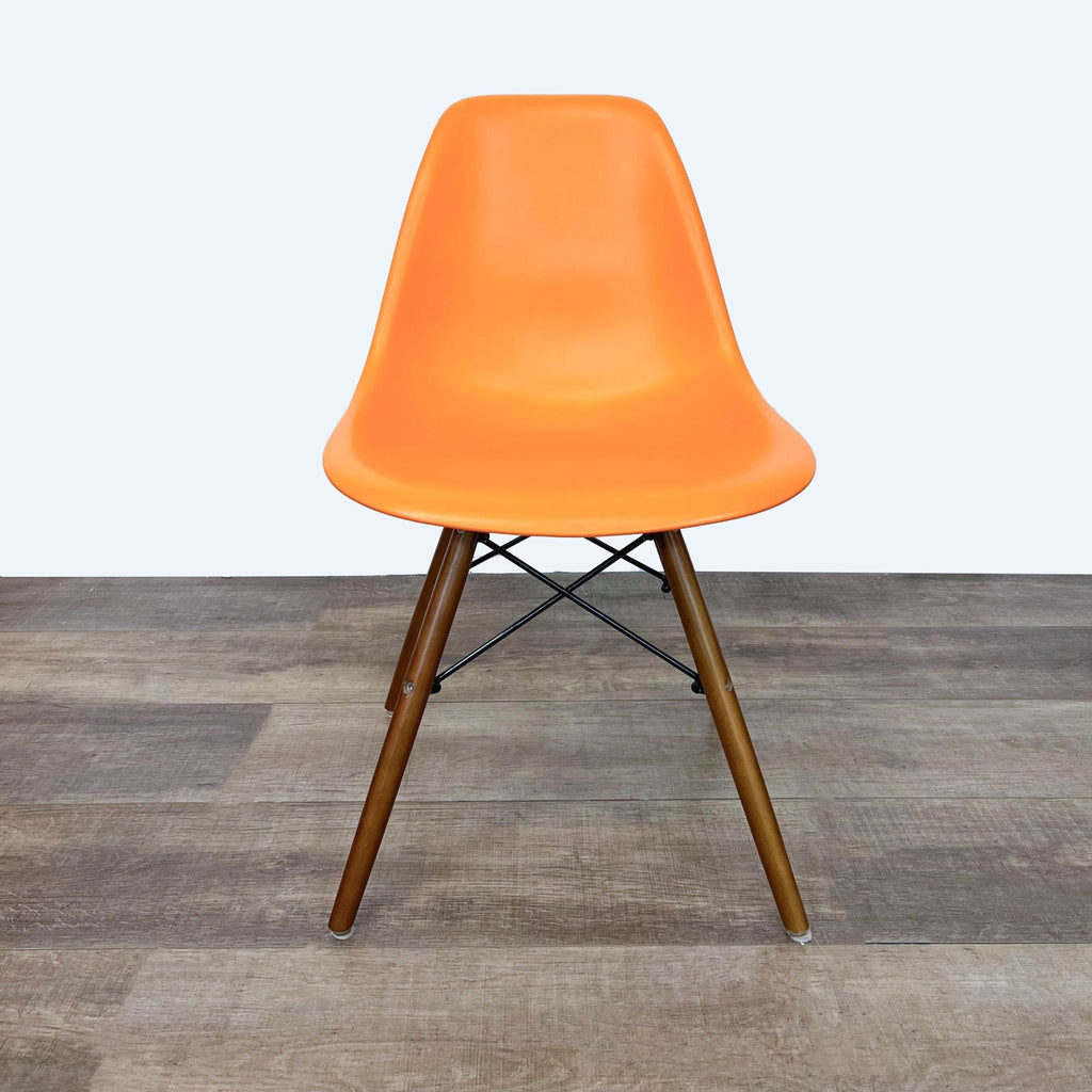 Front view of vibrant orange dining chair by Reperch.