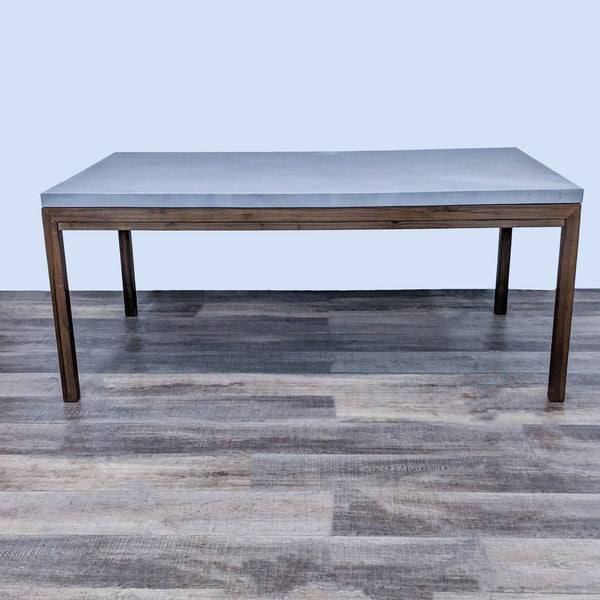 Reperch dining table with a concrete top and walnut stained base, Parsons style.