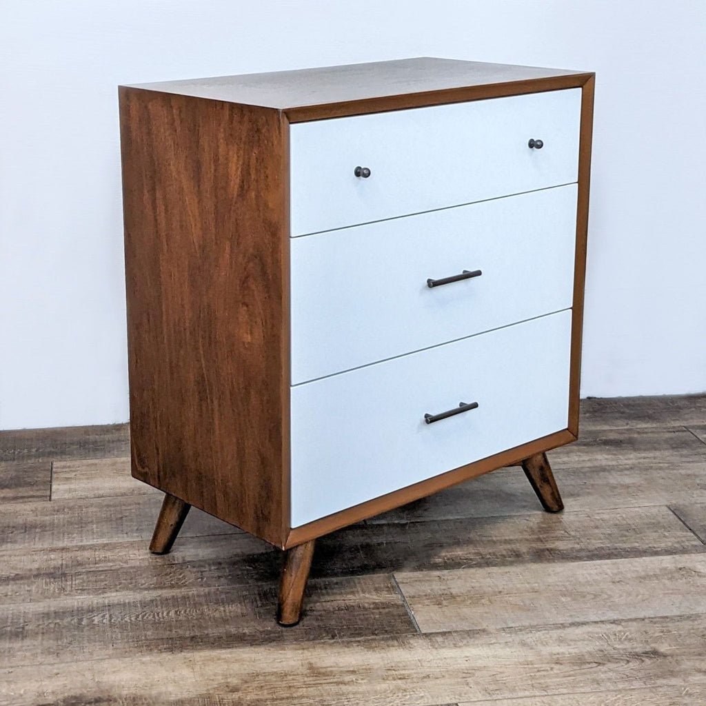 Angle view of Oliver Space dresser, featuring clean design and sleek handles.