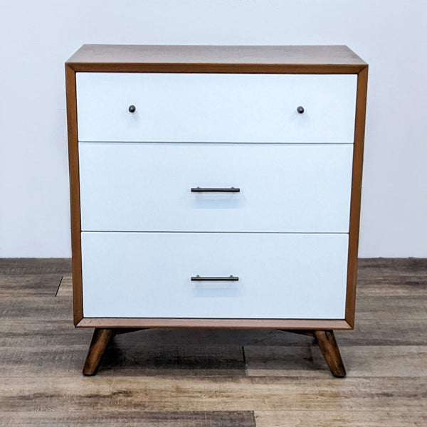 Oliver Space mid-century dresser with white drawers and angled legs.