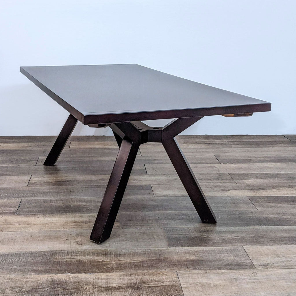 Sleek, dark wood table with a sturdy design and two removable extension leafs for added length.