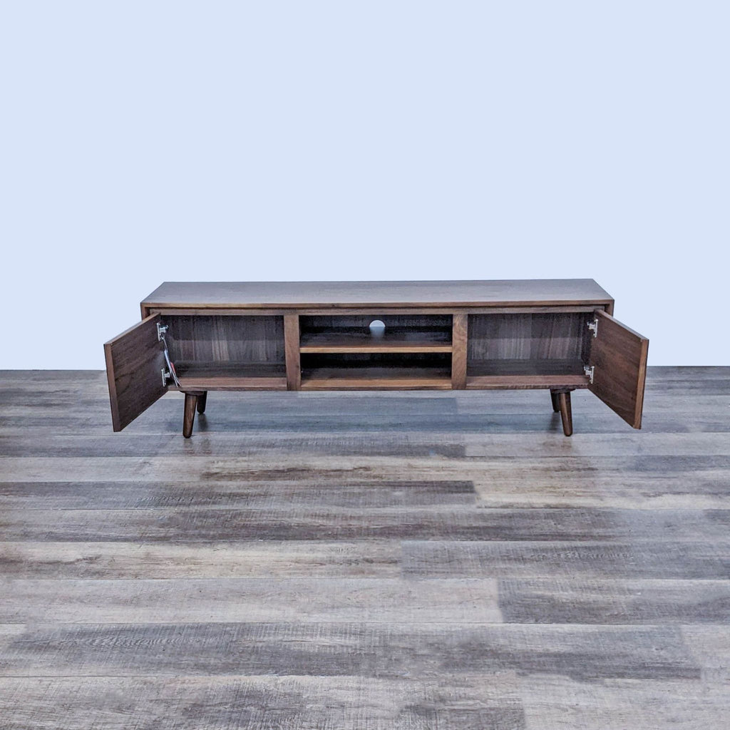 Wood entertainment center with open cabinet and removable shelf by Article.