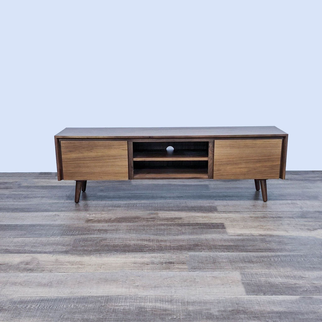 Mid-Century Modern entertainment center with two closed and one open cabinet.