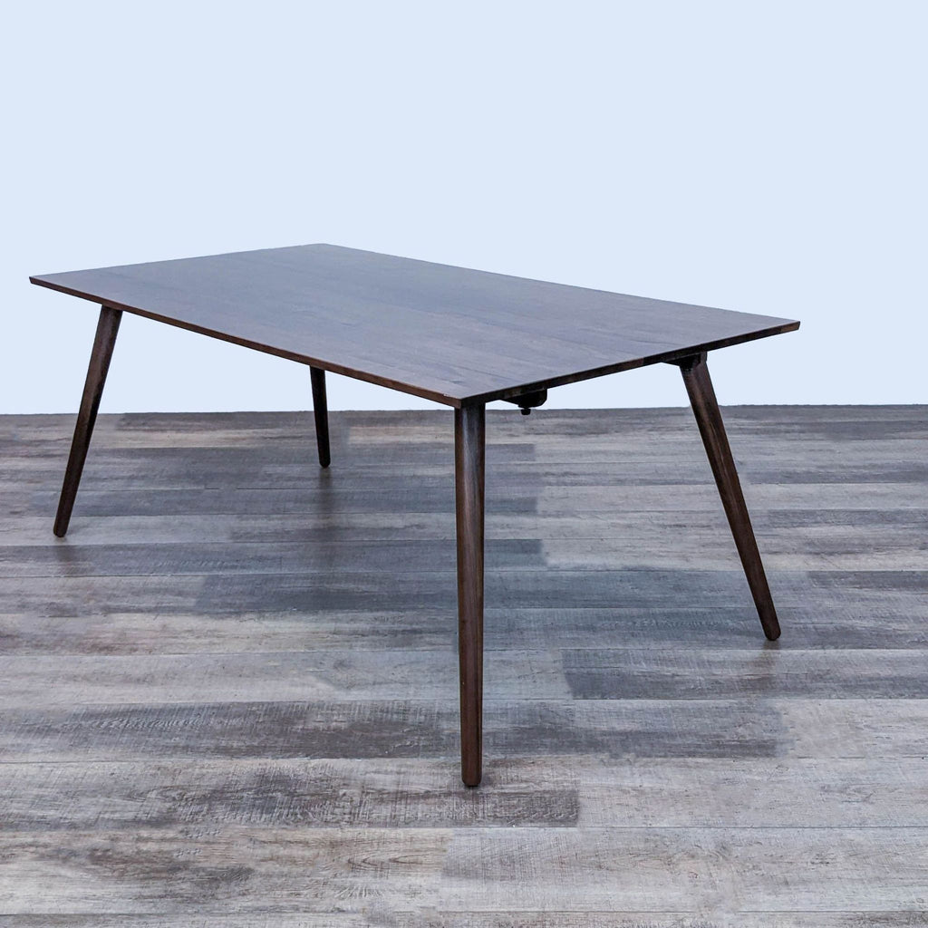 Elegant Seno table by Article with a flat top and tapered legs for a modern touch.