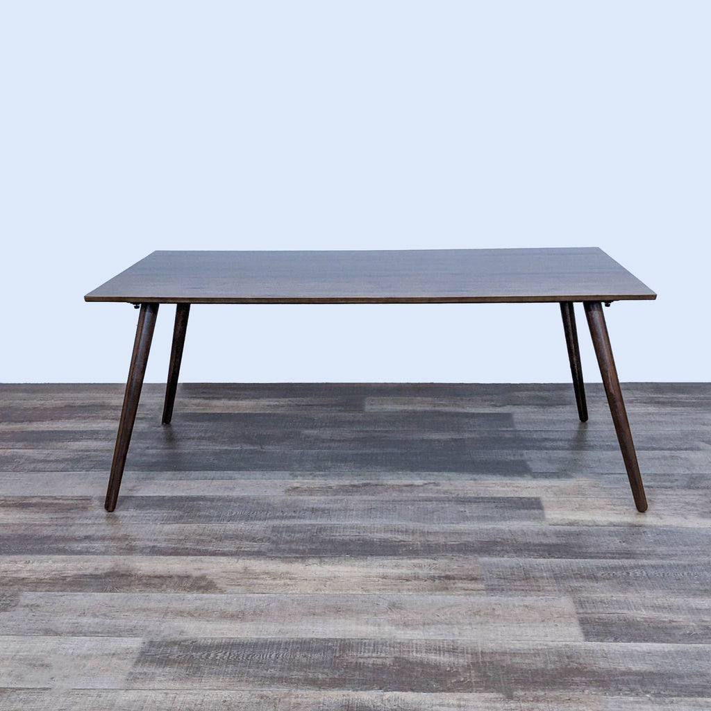 Mid-century modern Seno dining table with clean lines and tapered wood legs.
