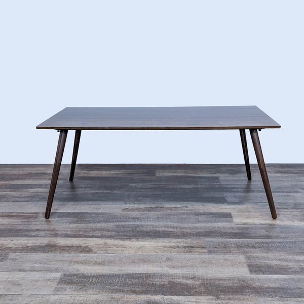 Mid-century modern Seno dining table with clean lines and tapered wood legs.