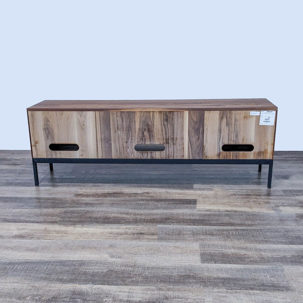 "Unfinished wood veneer entertainment unit with black steel hardware and perforated doors."