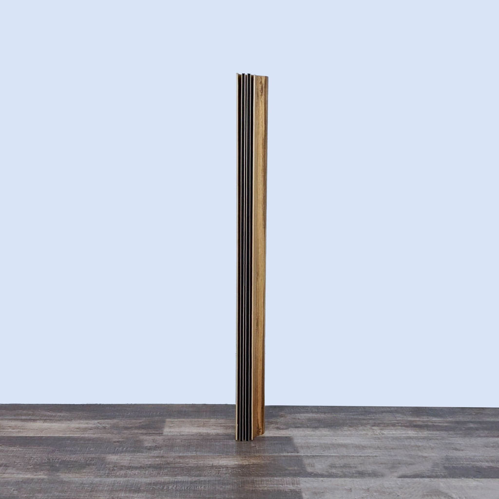 Side view of the limited edition Herman Miller rosewood screen, showcasing its narrow profile.