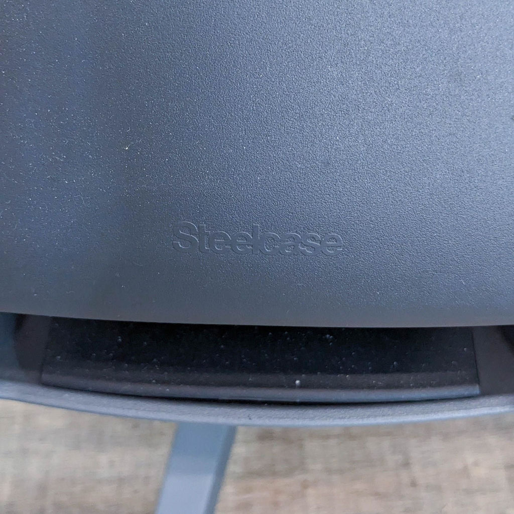 Close-up of Steelcase logo on the back of the Gesture office chair.