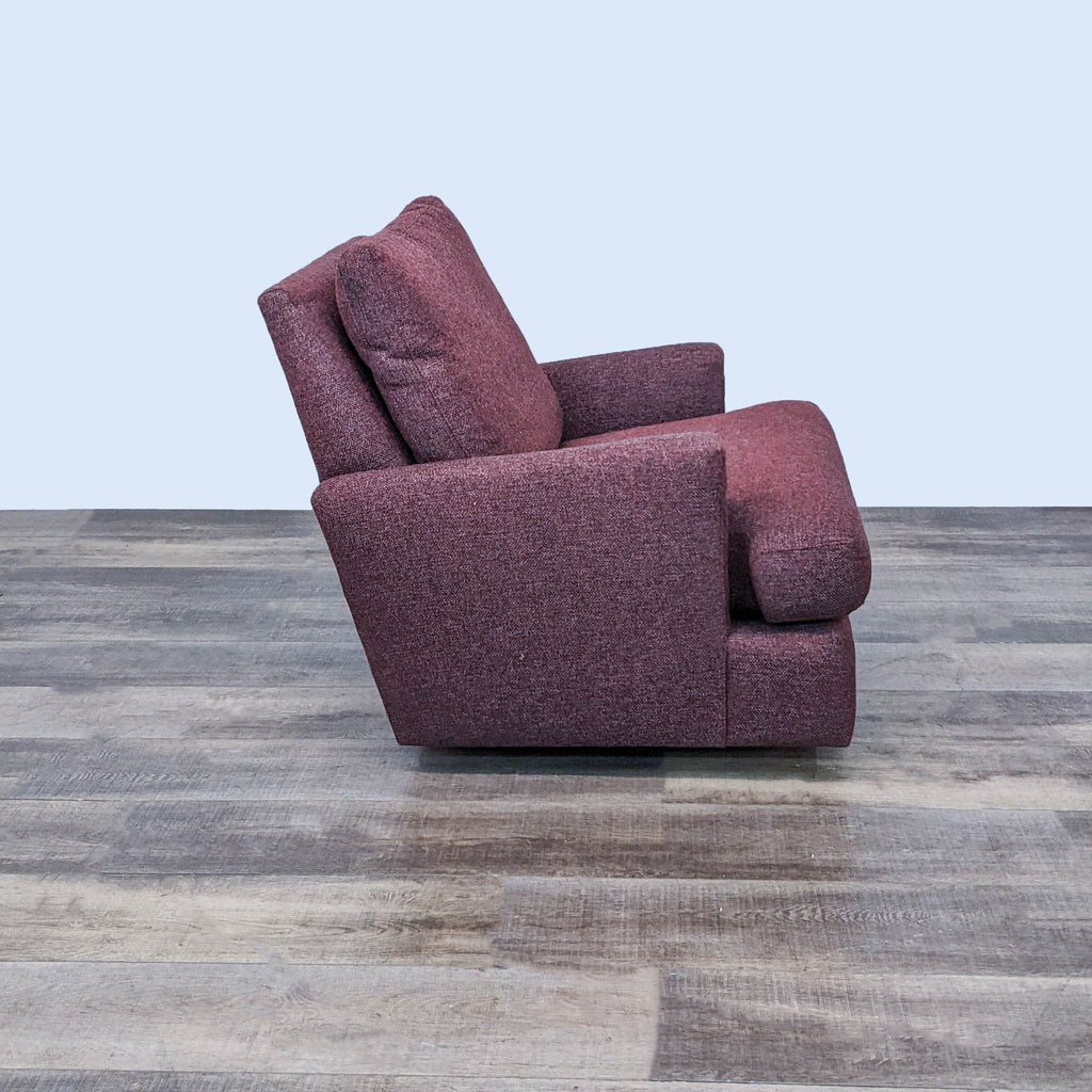 a [ unused0 ] recliner in a purple fabric.