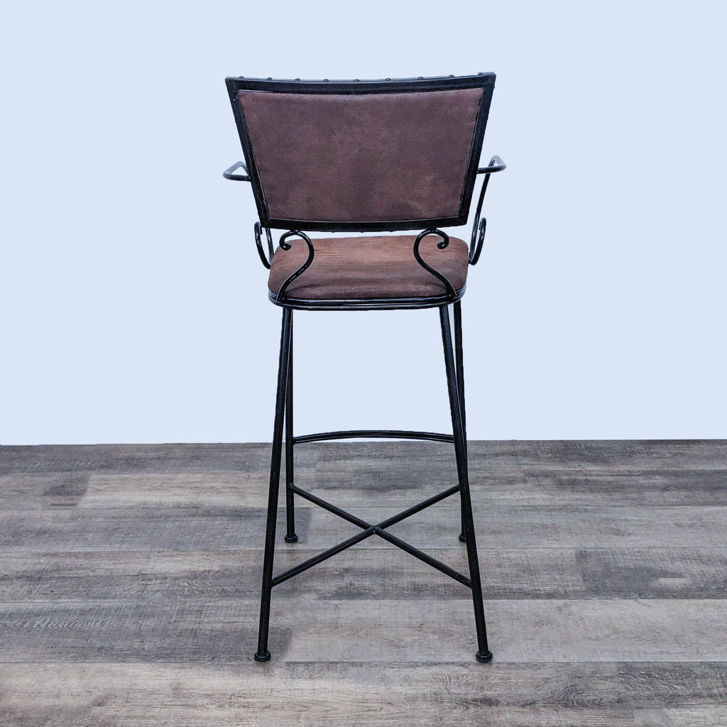 Metal upholstered Chesington stool from Pier 1 Imports with a cushioned back and seat.