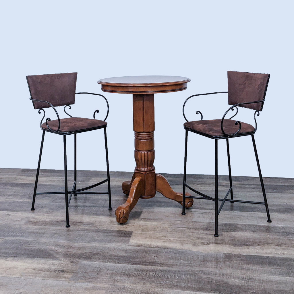 Three-piece dining set with stools and a round pedestal table from Pier 1 Imports.