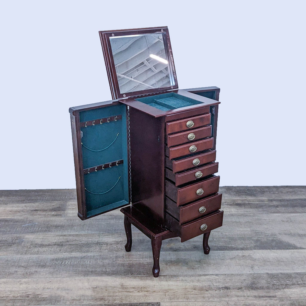 Armoire with open top revealing mirror, side compartments, and hooks.