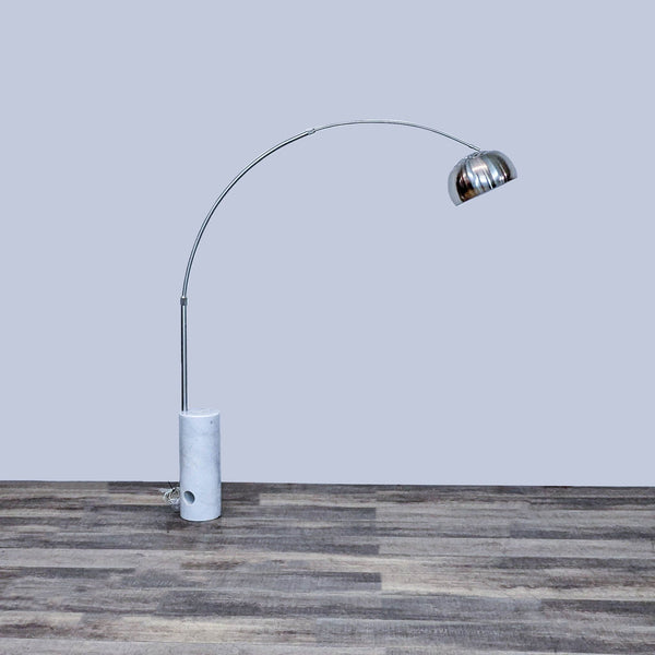 Reperch floor lamp with arched metal arm and round stone base for stability, in the Lighting category.