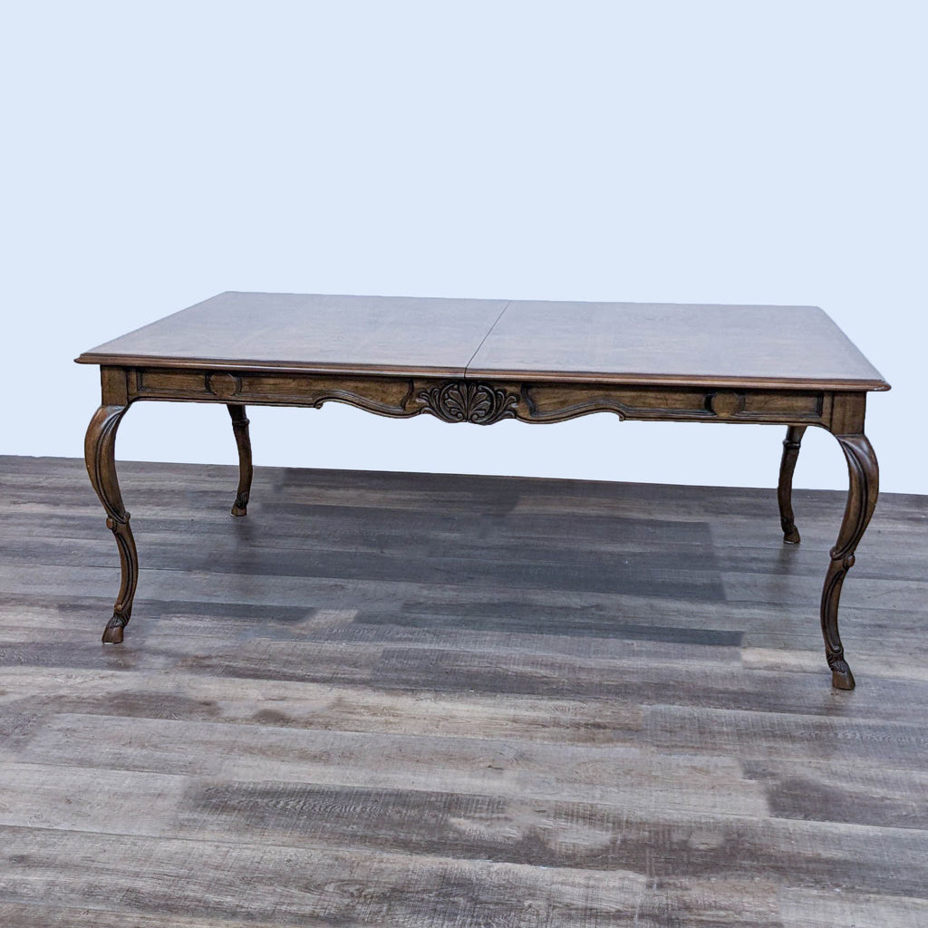 Elegant rectangular Drexel Heritage wooden dining table with cabriole legs and carved details.