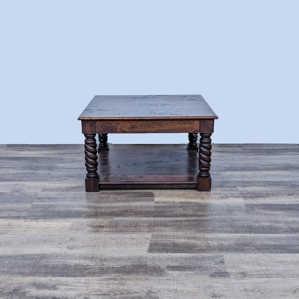 Dark wooden Reperch coffee table, showing a side view with barley twist legs and top detail.