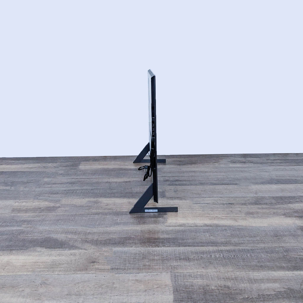 Side profile of the LG TV highlights its sleek and contemporary slim design.