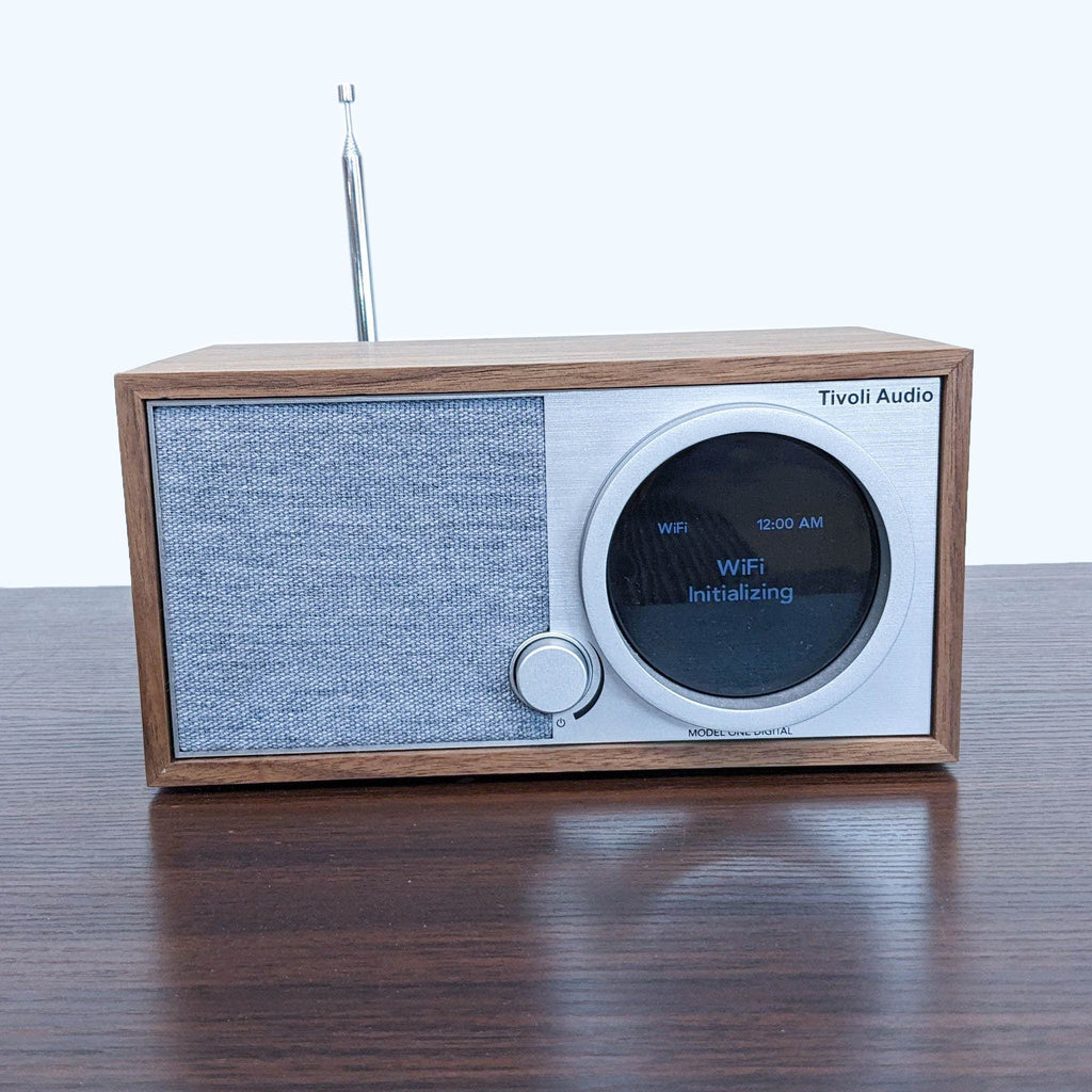 Tivoli Audio Model One in walnut casing with fabric speaker, providing Wi-Fi, FM, and Bluetooth.