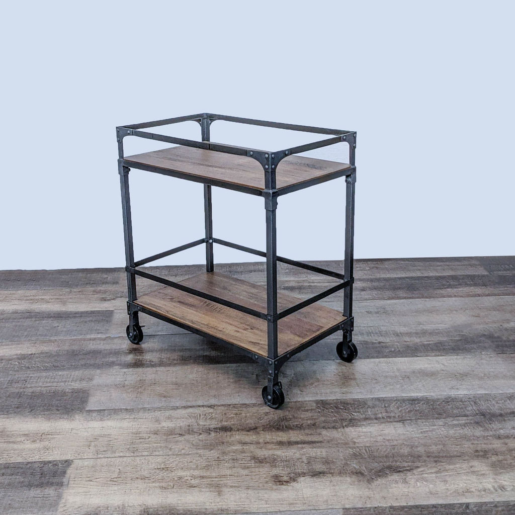 Cost Plus two-shelf cart with a metal frame and wheels on a wooden floor.