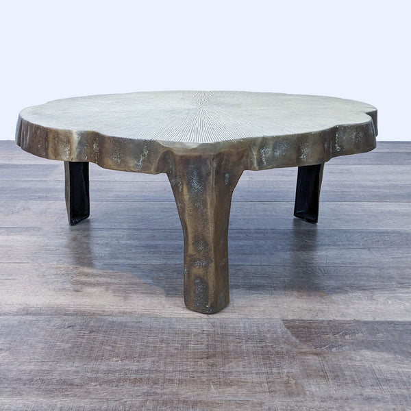 Lily pad-shaped coffee table with brass patina finish, adding elegance to any space.