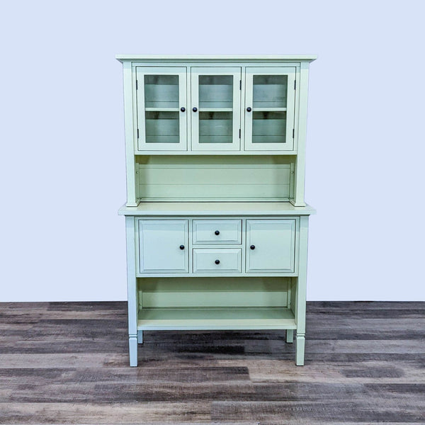 Farmhouse-style hutch with glass doors, designed by Kathleen Wills for Crate & Barrel.