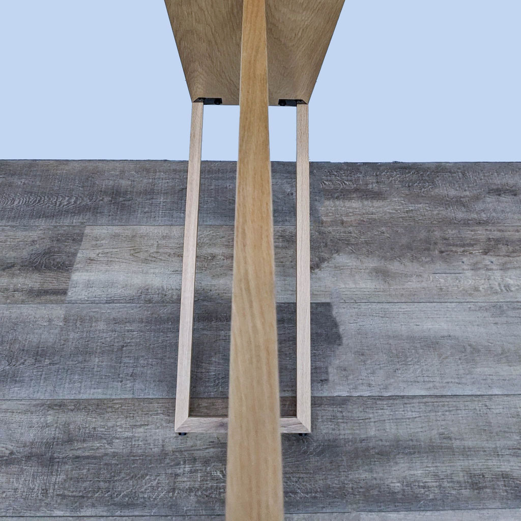 Top view of Reperch console table showcasing slender wooden design.