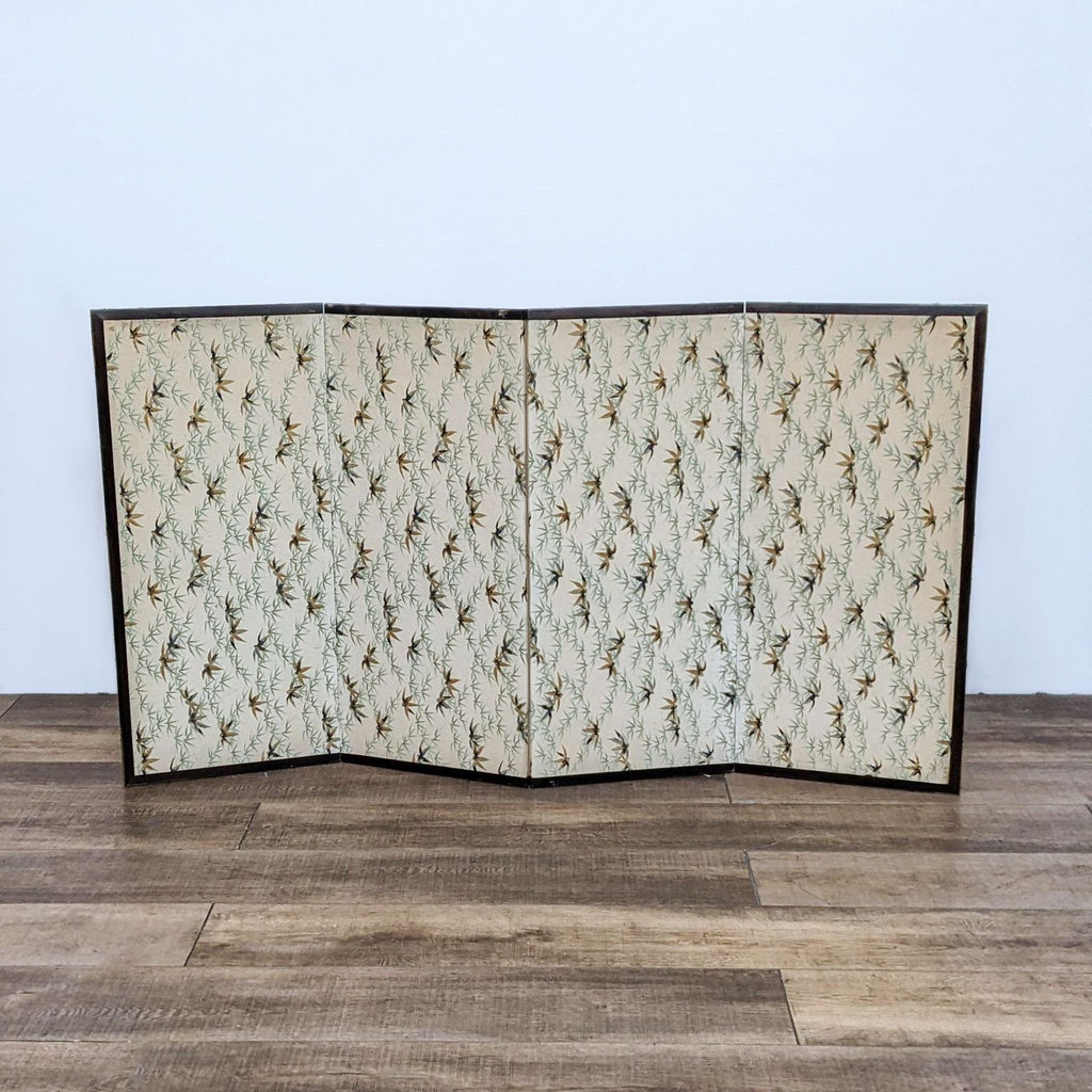 Back view of a silk folding screen featuring a repeating bamboo pattern. Textured decorative design.