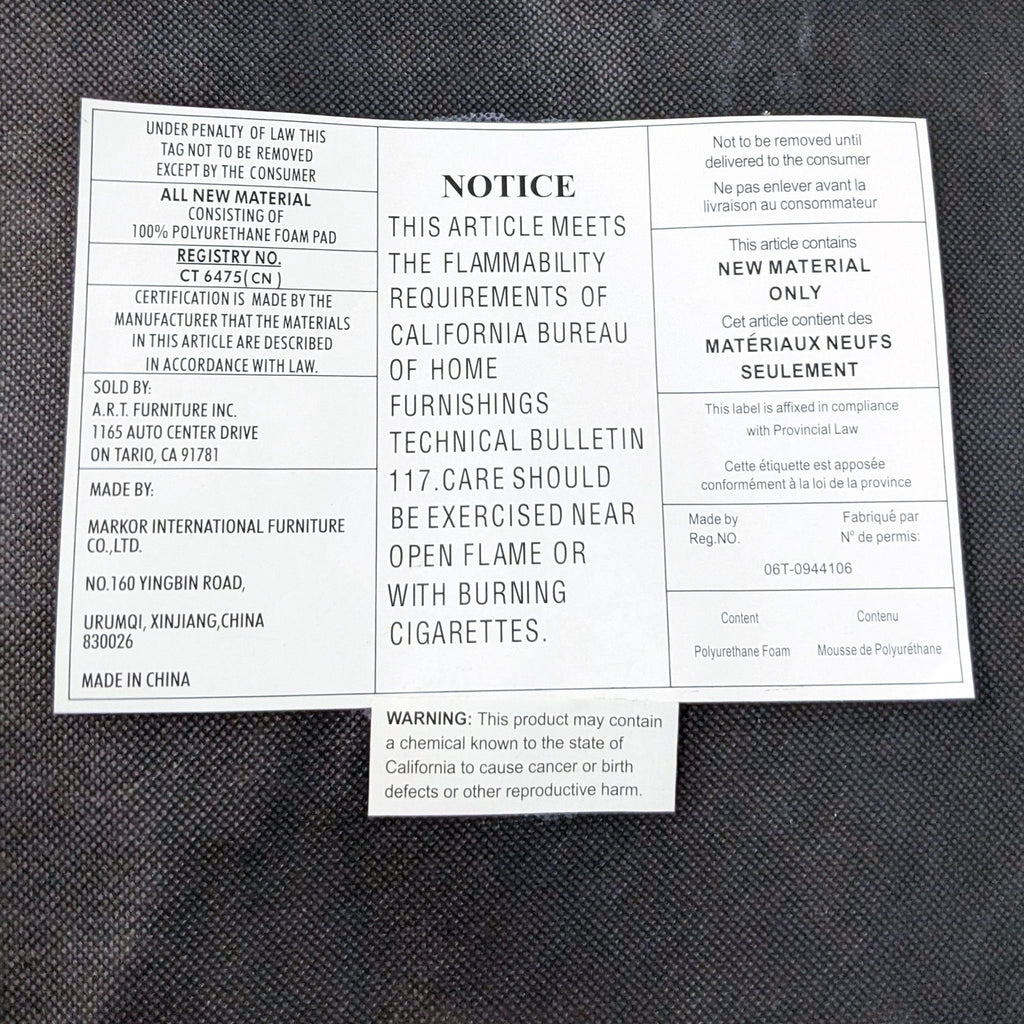 Close-up of a warning label for a Queen Anne style armchair by A.R.T. Furniture Inc., noting flammability standards and material composition.